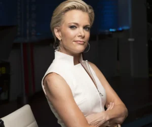 Megyn Kelly is smiling while wearing white.