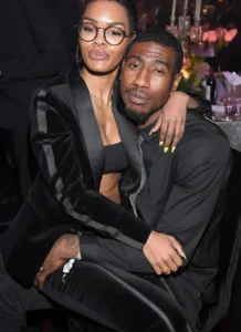 Iman Shumpert holds the girl in her lap.