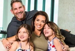 Grant Cardone is sitting with the girl and two little girls, laughing.
