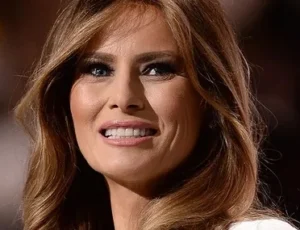 Melania Trump is laughing.