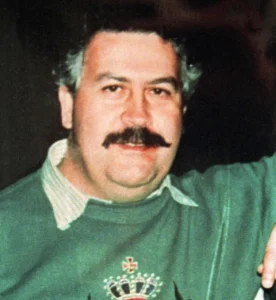 Pablo Escobar stands wearing a green jersey.