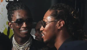 Young Thug is talking with another boy.