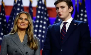 Melania Trump stands with her son.
