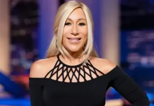 Lori Greiner is laughing while wearing black.