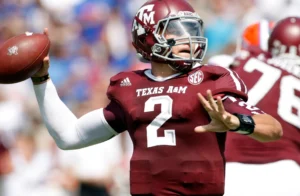 Texas A&M ka quarterback football throw karte hue action mein, jersey number 2 pehne hue.